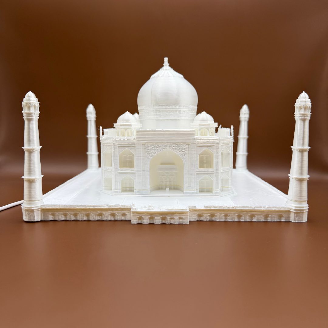 3D Printed Taj Mahal LED lamp with intricate architectural details and warm ambient lighting.